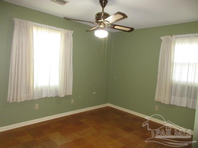 spare room featuring ceiling fan