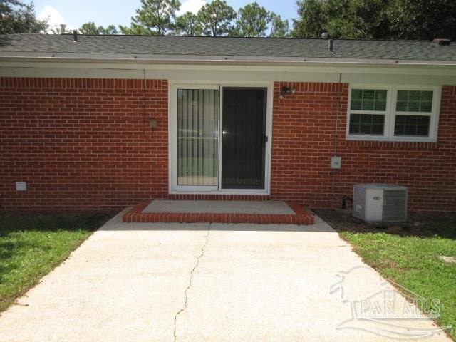 property entrance featuring a patio and central AC