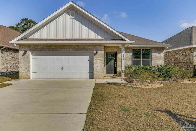 view of front facade with a garage and a front lawn