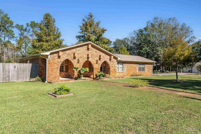 ranch-style home featuring a front yard