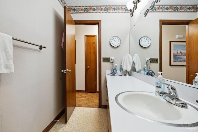 bathroom featuring vanity and parquet floors