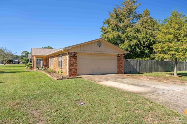 ranch-style home featuring a garage and a front yard