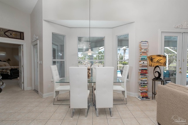 tiled dining room featuring plenty of natural light