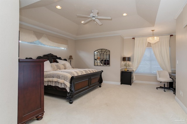 carpeted bedroom featuring ceiling fan with notable chandelier, ornamental molding, and a raised ceiling