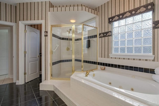 bathroom featuring tile patterned floors and separate shower and tub