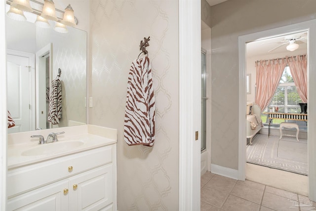 bathroom featuring tile patterned flooring, vanity, and ceiling fan