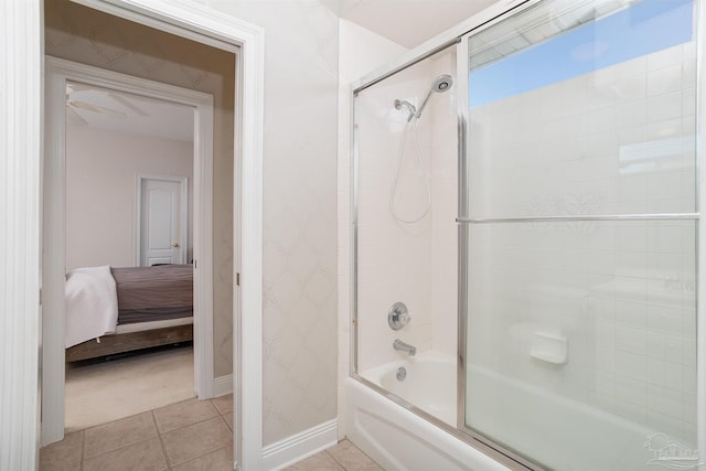 bathroom featuring bath / shower combo with glass door and tile patterned flooring