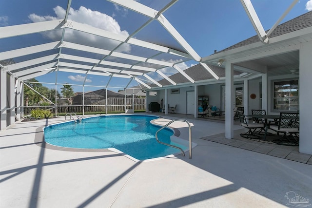 view of swimming pool featuring a lanai and a patio