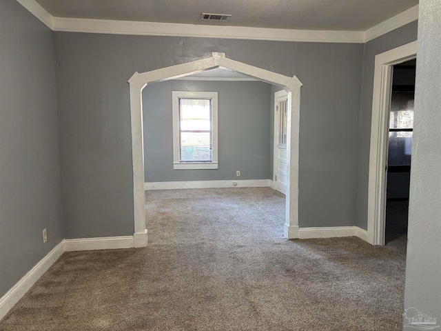 carpeted empty room with crown molding