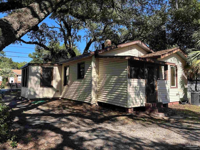 view of side of property with central AC unit