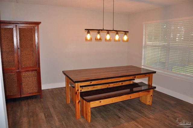 dining space with dark wood-style floors and baseboards