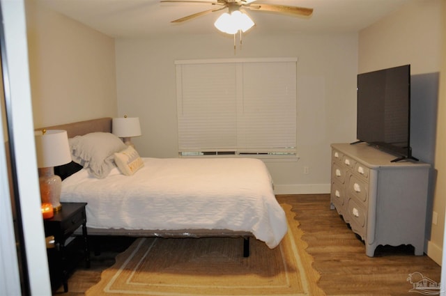 bedroom with wood-type flooring and ceiling fan