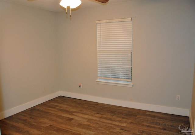 unfurnished room with ceiling fan and dark wood-type flooring