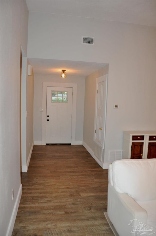 entrance foyer featuring dark hardwood / wood-style floors