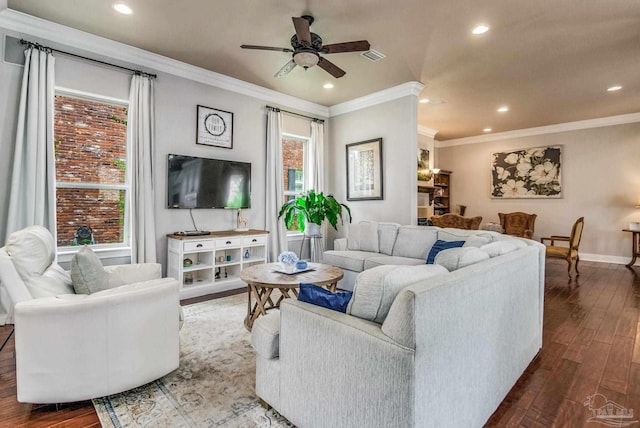 living room with ornamental molding, dark hardwood / wood-style floors, and ceiling fan