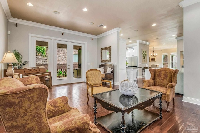 living area with ornamental molding, dark hardwood / wood-style floors, and french doors