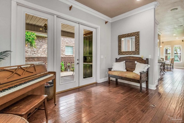 interior space with ornamental molding, dark hardwood / wood-style flooring, and french doors