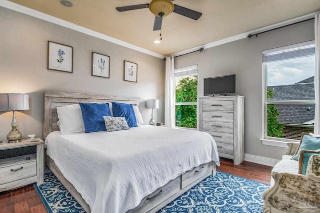 bedroom featuring ornamental molding, dark hardwood / wood-style floors, and ceiling fan