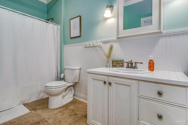 bathroom featuring tile patterned floors, vanity, and toilet