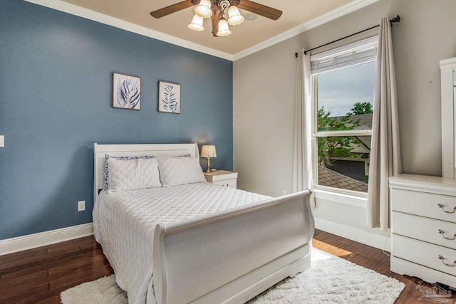 bedroom featuring crown molding, ceiling fan, and dark wood-type flooring