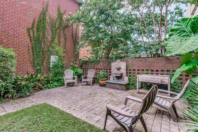 view of patio / terrace with an outdoor stone fireplace