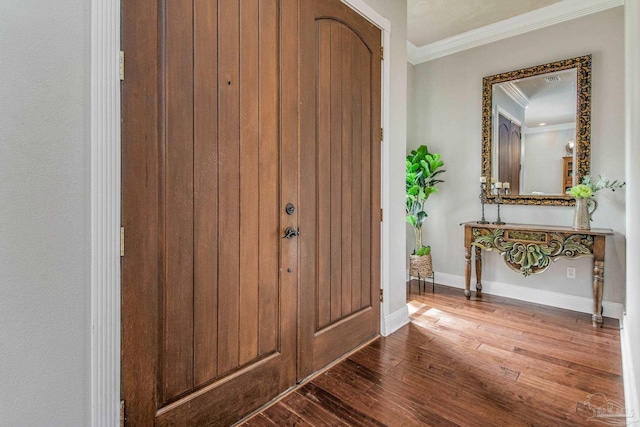 entryway featuring wood-type flooring and ornamental molding