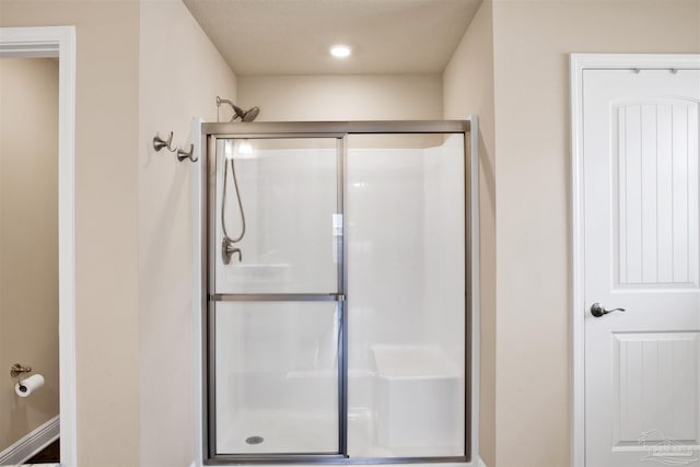 bathroom with a stall shower