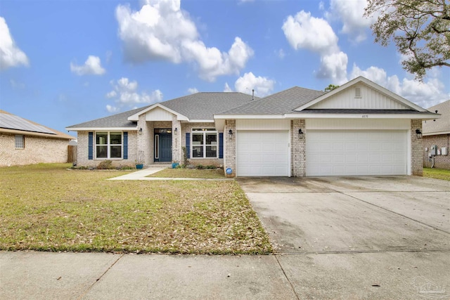 view of front of house with concrete driveway, roof with shingles, an attached garage, a front lawn, and brick siding