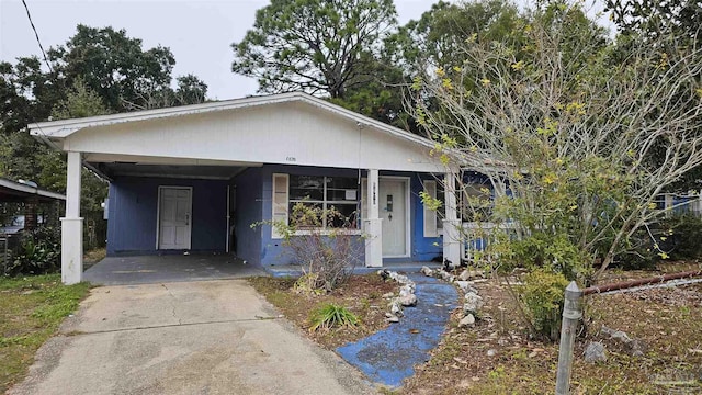 bungalow-style house featuring a carport