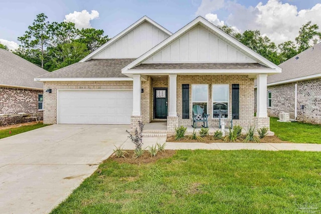 9777 Windy Hill Rd, Pensacola, FL 32526 - craftsman house with board and batten siding, brick siding, covered porch, and a garage