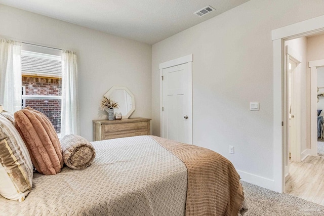 9777 Windy Hill Rd, Pensacola, FL 32526 - bedroom featuring multiple windows and carpet floors
