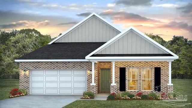 9777 Windy Hill Rd, Pensacola, FL 32526 - view of front of home with board and batten siding, brick siding, roof with shingles, driveway, and a garage