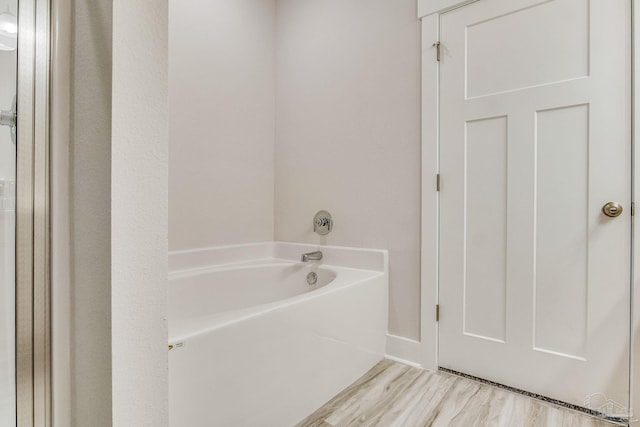9777 Windy Hill Rd, Pensacola, FL 32526 - full bath featuring a garden tub and wood finished floors
