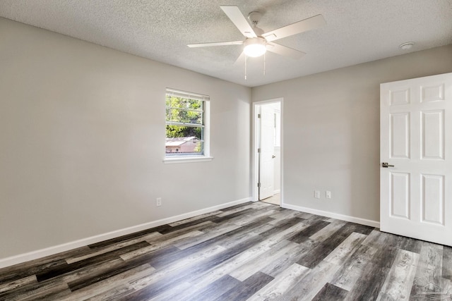7125 Ben Sasser Dr, Pensacola, FL 32526 - unfurnished bedroom featuring dark wood-style flooring, a textured ceiling, and ceiling fan