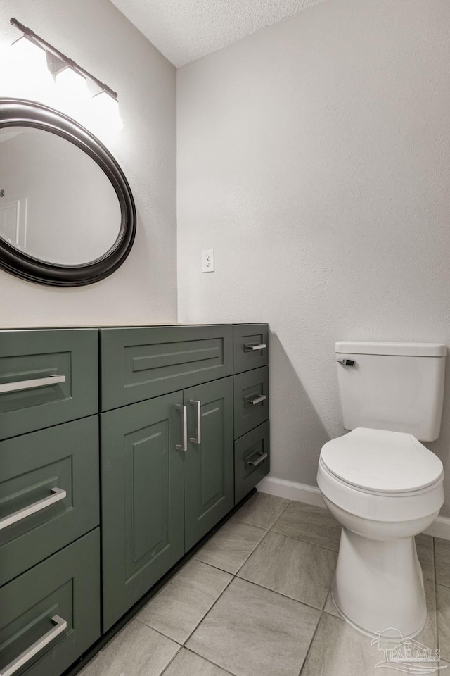 7125 Ben Sasser Dr, Pensacola, FL 32526 - bathroom featuring a textured ceiling, tile patterned flooring, and vanity