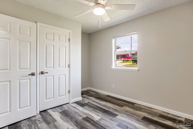 7125 Ben Sasser Dr, Pensacola, FL 32526 - unfurnished bedroom featuring wood finished floors, a textured ceiling, and a ceiling fan