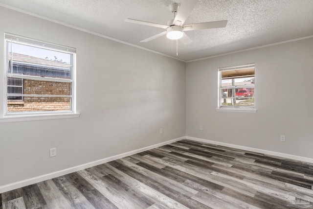 7125 Ben Sasser Dr, Pensacola, FL 32526 - unfurnished room featuring a textured ceiling, healthy amount of natural light, wood finished floors, ceiling fan, and ornamental molding