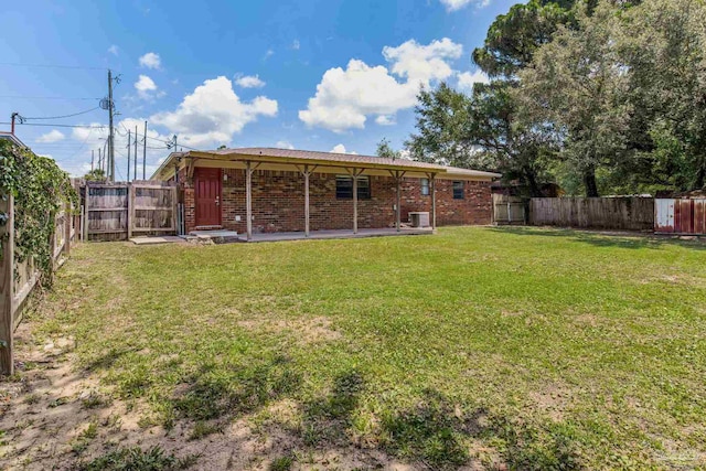 7125 Ben Sasser Dr, Pensacola, FL 32526 - rear view of property with brick siding and a fenced backyard