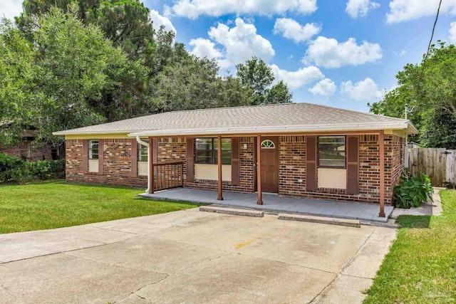 7125 Ben Sasser Dr, Pensacola, FL 32526 - ranch-style house featuring brick siding, covered porch, roof with shingles, and uncovered parking