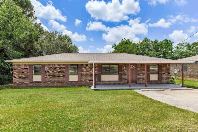 7125 Ben Sasser Dr, Pensacola, FL 32526 - ranch-style house with a front yard, brick siding, covered porch, and a shingled roof