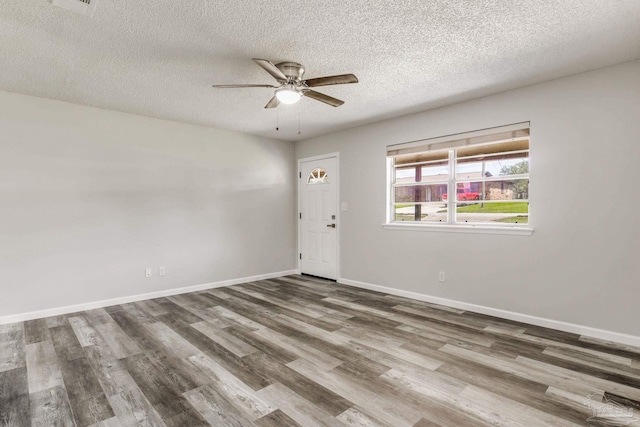 7125 Ben Sasser Dr, Pensacola, FL 32526 - unfurnished room with ceiling fan, wood finished floors, and a textured ceiling