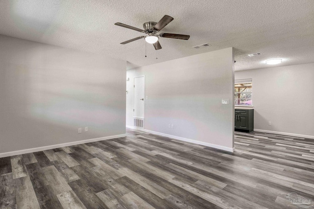 7125 Ben Sasser Dr, Pensacola, FL 32526 - unfurnished room featuring a textured ceiling, wood finished floors, and a ceiling fan