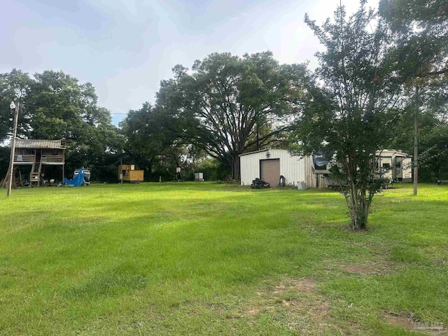 2939 Sundance Ln, Cantonment, FL 32533 - view of green lawn featuring an outdoor structure