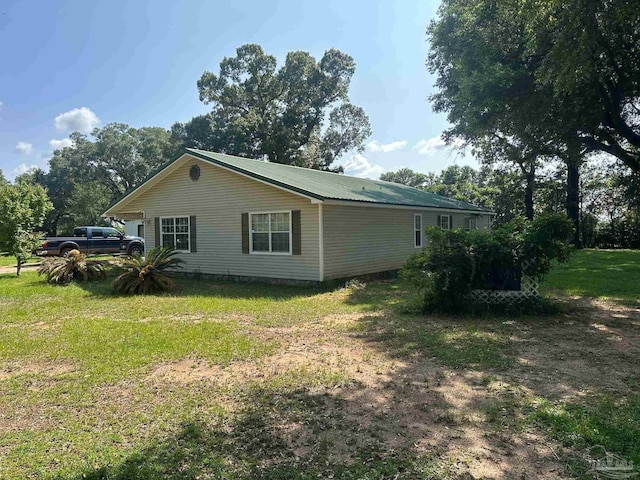 2939 Sundance Ln, Cantonment, FL 32533 - view of side of home featuring a yard
