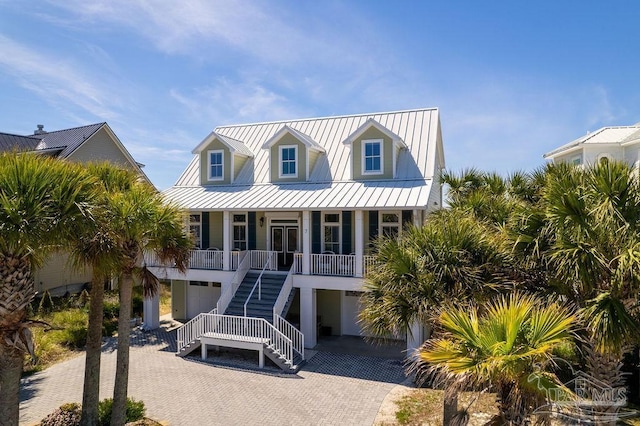 view of front of home featuring covered porch and a garage