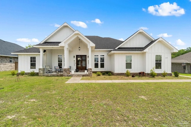 2420 Okatie Ln, Cantonment, FL 32533 - modern farmhouse with board and batten siding, roof with shingles, and a front yard