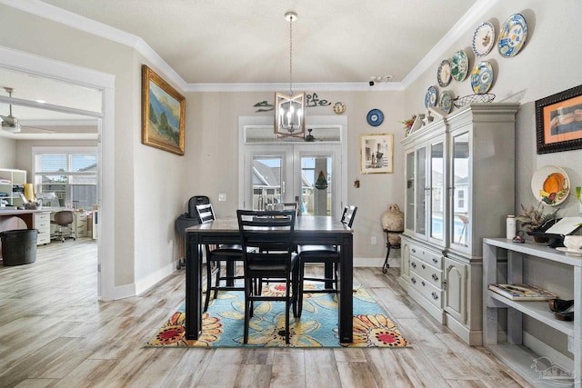 2420 Okatie Ln, Cantonment, FL 32533 - dining area featuring crown molding, light wood finished floors, baseboards, and ceiling fan