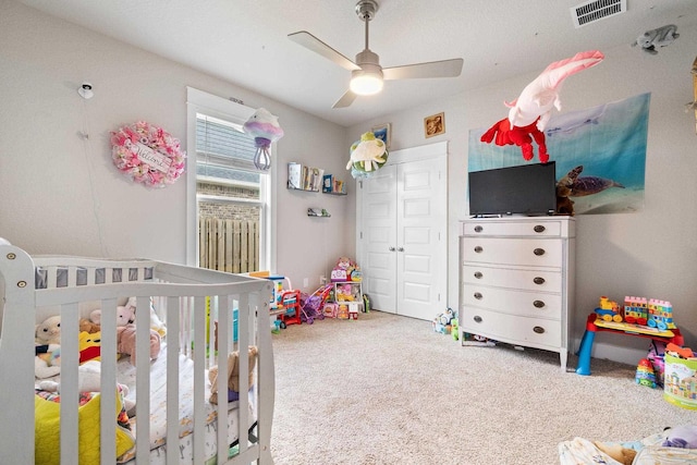 2420 Okatie Ln, Cantonment, FL 32533 - carpeted bedroom with a nursery area, visible vents, a closet, and ceiling fan