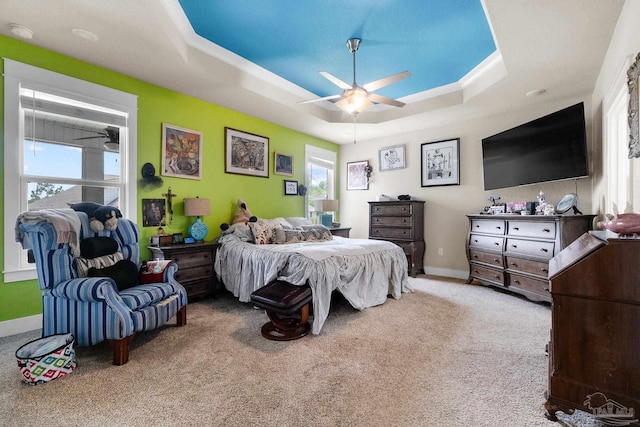 2420 Okatie Ln, Cantonment, FL 32533 - carpeted bedroom featuring a raised ceiling, baseboards, and ceiling fan