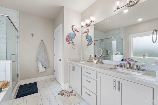 2420 Okatie Ln, Cantonment, FL 32533 - full bathroom with marble finish floor, a sink, double vanity, and a stall shower